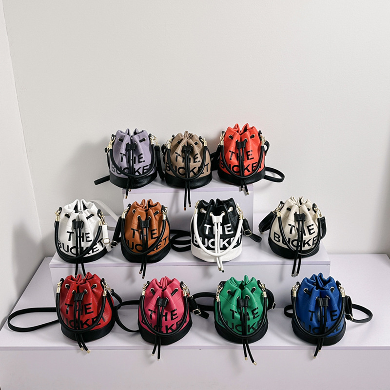 Bolso de hombro femenino casual todo-fósforo diseño de nicho sentido contraste color costuras cubo bolso de mano moda tendencia bandolera