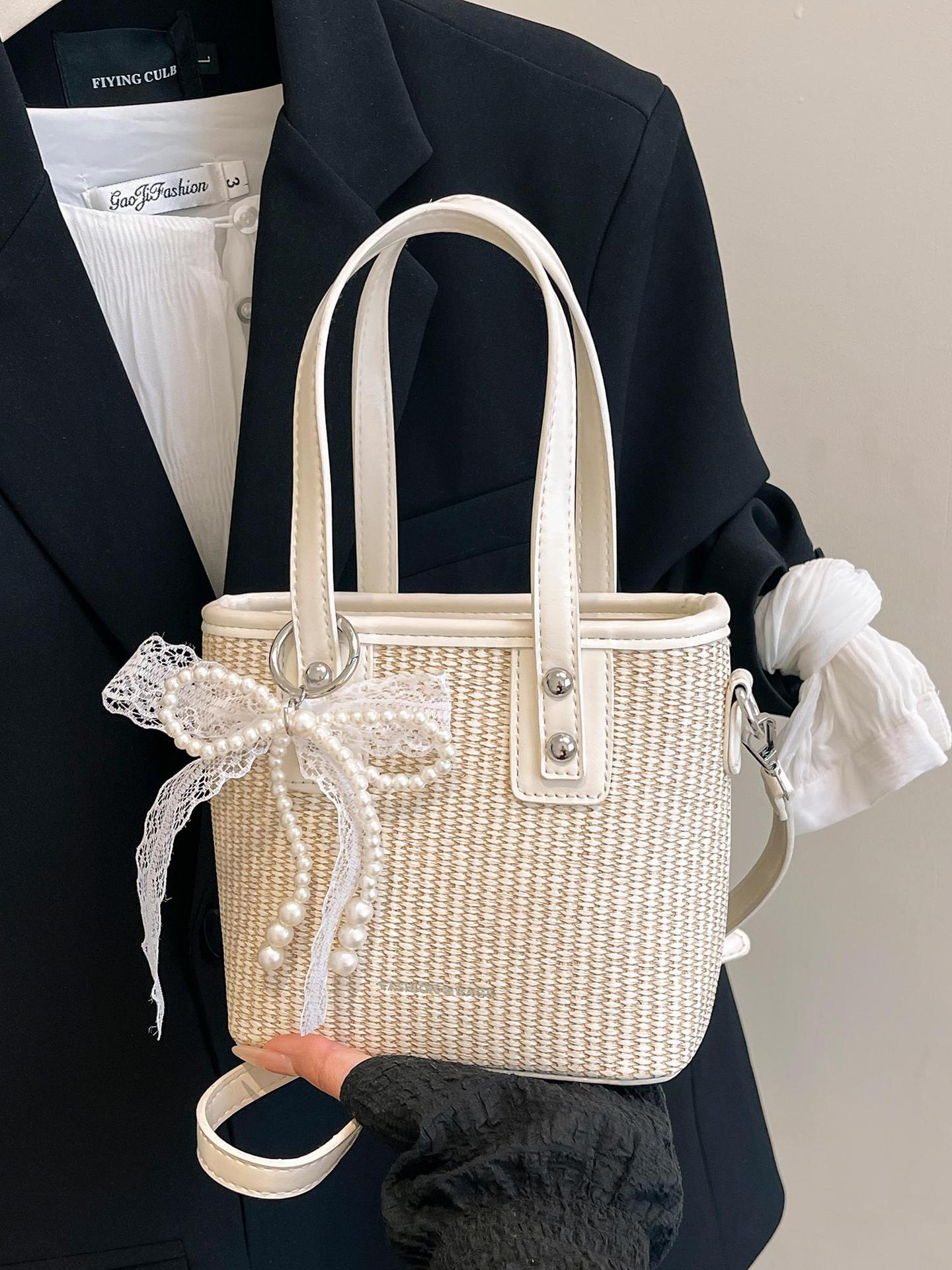 Bolsa de balde de mano caliente de verano para mujeres 2025 nueva bolsa de playa de vacaciones de playa bolsa de tejido bolsa de paja