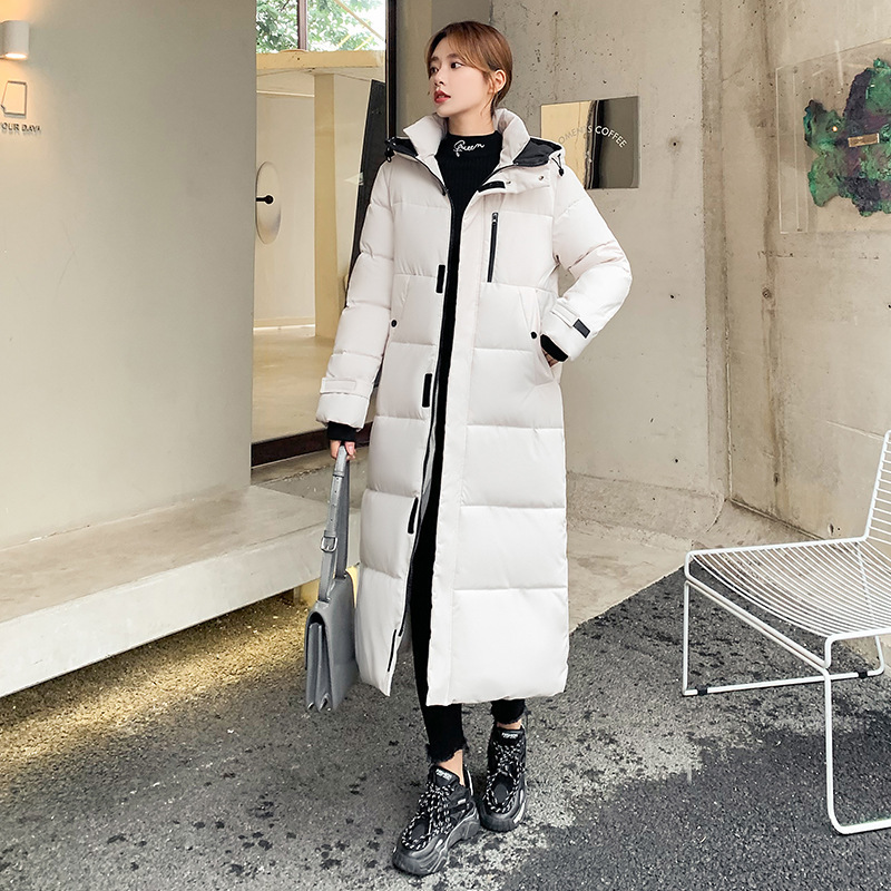 Nuevo comercio exterior 2023 ropa de algodón coreana mujer invierno largo encapuchado rodilla ropa de algodón damas gruesa abrigo de algodón blanco