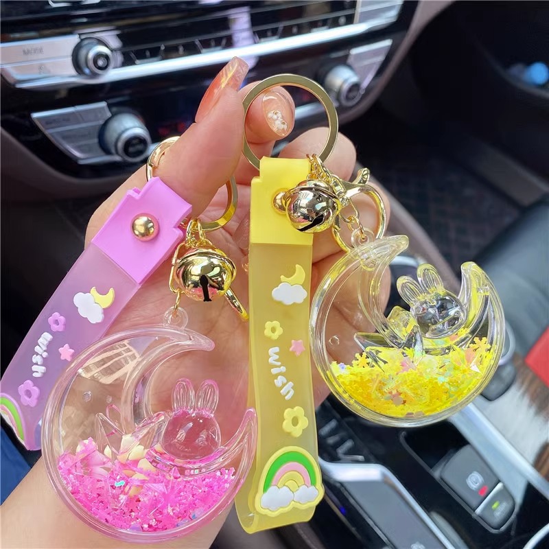 Red de aceite creativo rojo luminoso copo de nieve estrella Luna conejo Quicksand botella llavero femenino lindo Quicksand botella colgante bolsa adornos