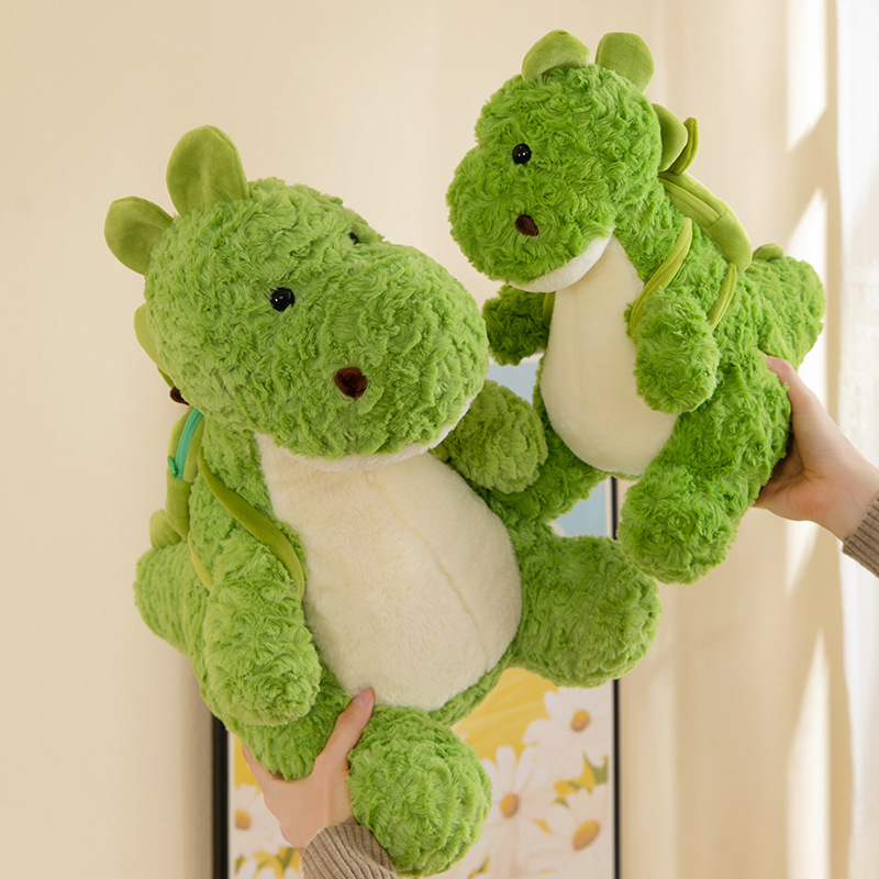 Nuevo aguacate mochila dinosaurio juguetes de peluche muñecas chicas regalo juguetes para niños muñecas de dibujos animados máquina de muñecas