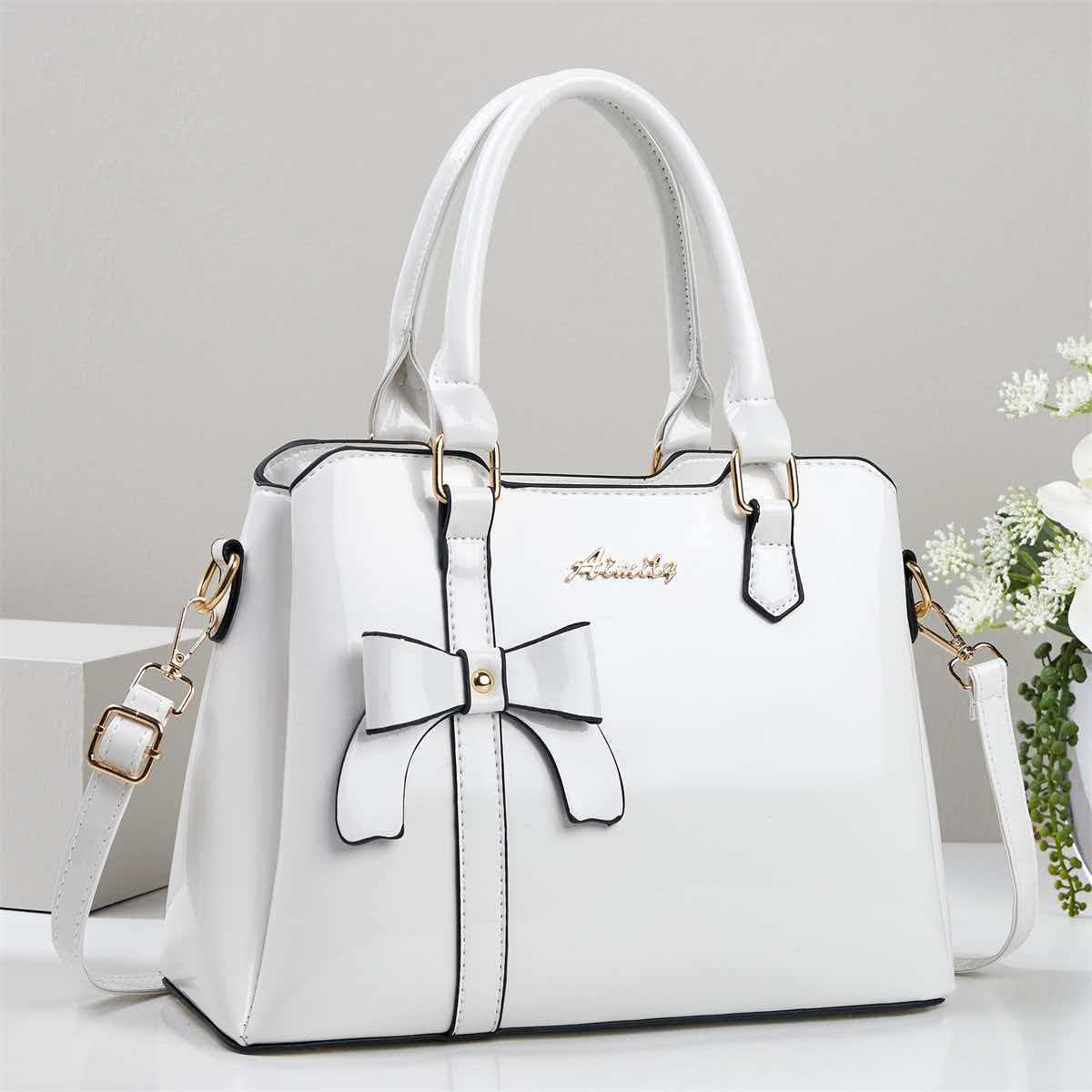 Bolso de mano de arco de piel brillante, bolso de hombro casual de moda, bolso de madre, temperamento, bolso de mochila transfronterizo