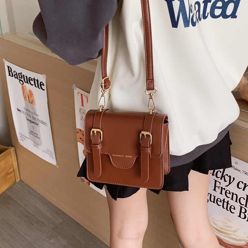 Nuevo cartero infantil Europa y América retro estilo británico universitario bolso de hombro para niños y niñas bolso de color sólido para niños