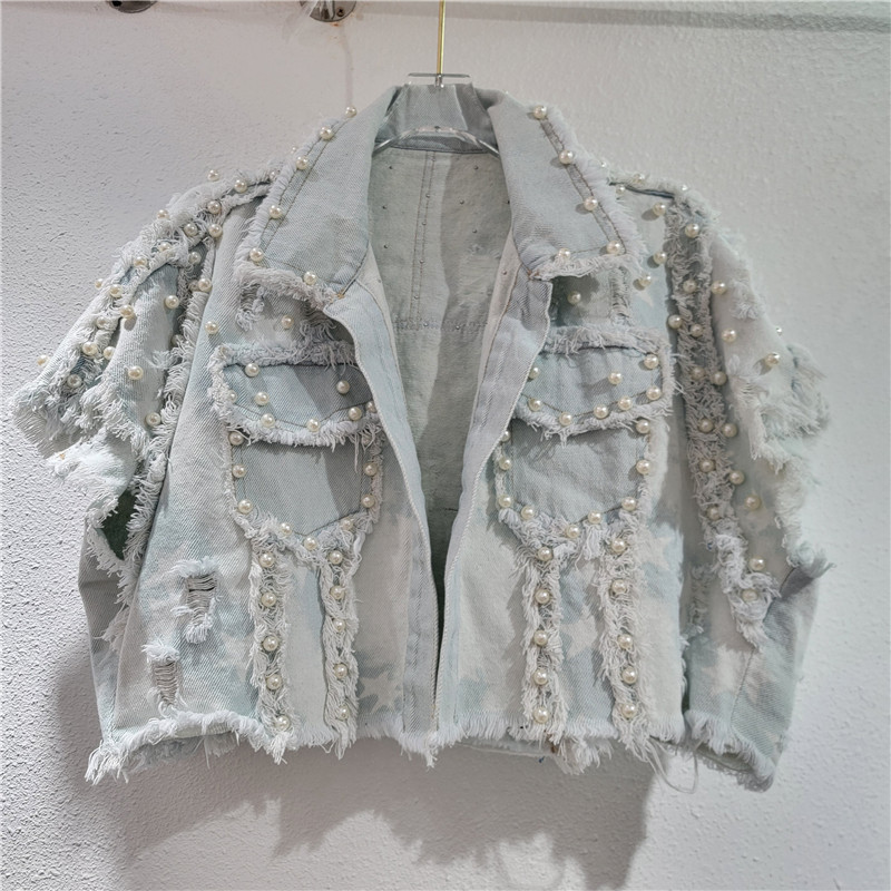 El sentido del diseño europeo y americano 2024 otoño nuevo estilo irregular bordes de polipas de clavos pesados cuentas retro caliente jeans caballo clips mujeres