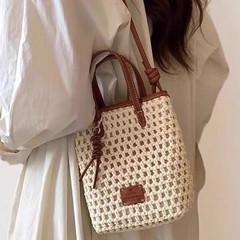 单肩斜挎包女式针织编织包镂空度假沙滩风撞色小桶包休闲手机包潮