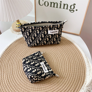 Original Niche Fabric Cosmetic Bag High Color Value Texture Thick and Durable Portable Carry-on Storage Bag European and American Clutch Bag