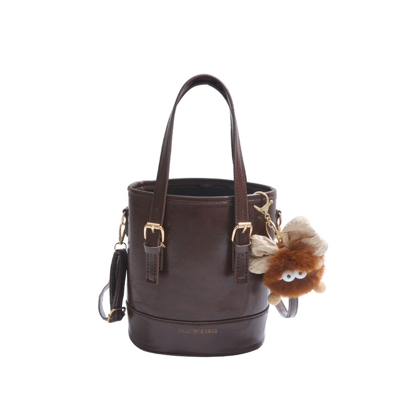 2025 nueva moda extranjera coreana bolso de cubo de mano simple ocio empalme viaje mochila de hombro para mujeres