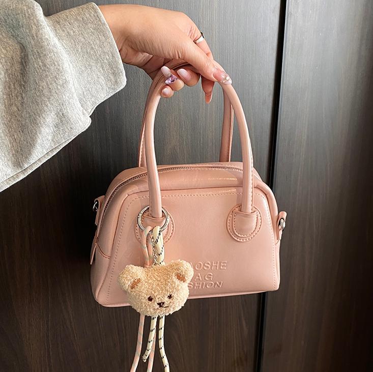 Este año, la moda de bolos de mano súper caliente para mujeres 2025 nuevo estilo coreano, textura casual, mochila de hombro