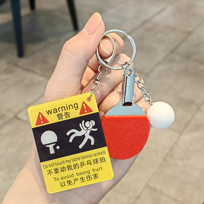 Falling ping pong warning sign + big ping pong ball