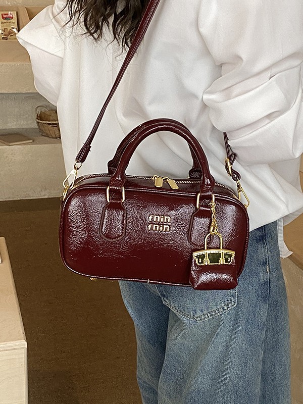 Bolso de bolos de mano popular de este año para mujeres 2026 nuevo sentido transfronterizo de alta calidad de viaje al trabajo mochila de hombro