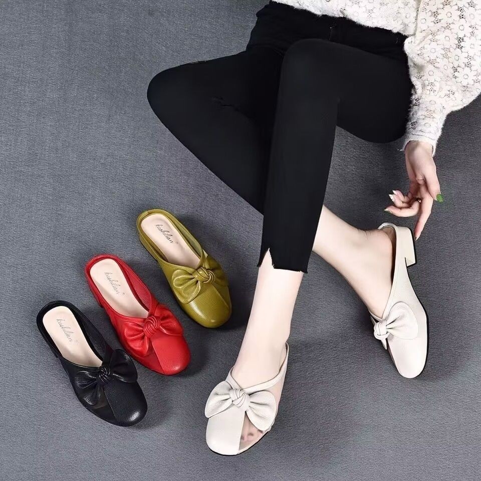Zapatillas de piel suave de tacón bajo para mujeres primavera y verano 2026 nuevas zapatillas de tela plana para la cabeza de la bolsa para usar zapatillas de mujer