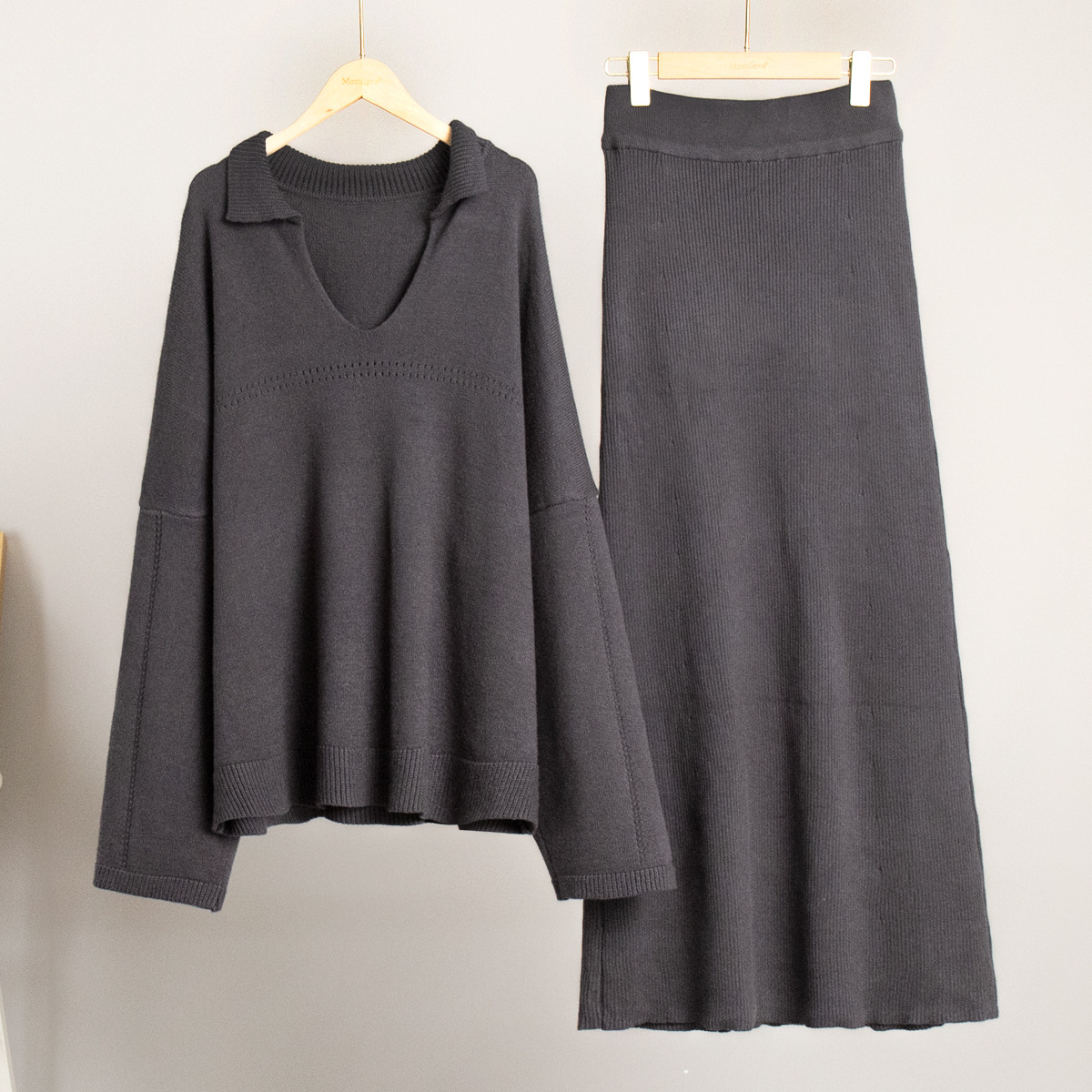 Conjunto de punto transfronterizo Europa y los Estados Unidos 2025 invierno nuevo estilo de moda minimalista viento suéter de punto de cuello V conjunto de falda de busto