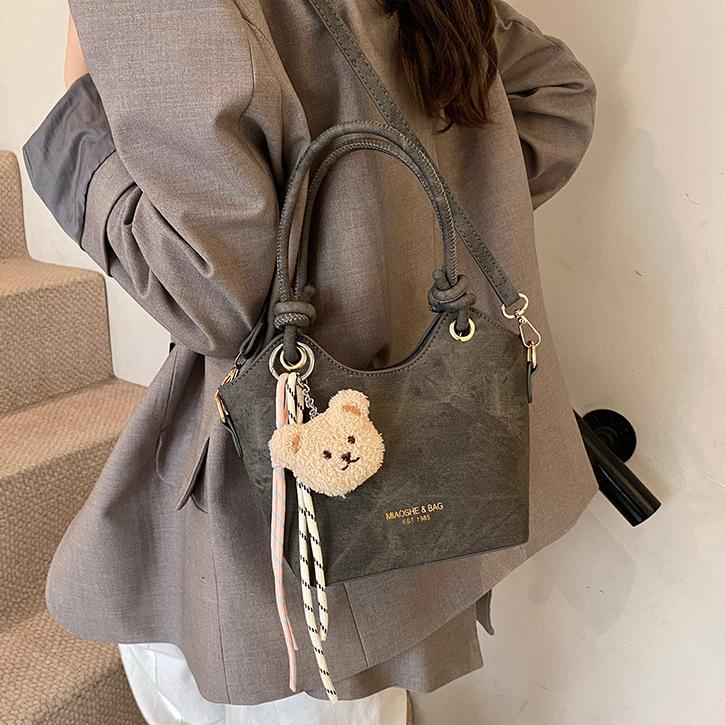 Corea del Sur ins moda bolso de cubo de mano 2025 nuevo estilo simple ocio versátil bolso de hombro textura superior