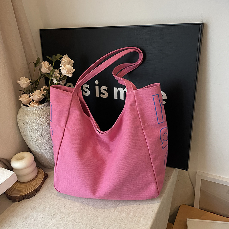 Bolso Tote de moda coreana 2025 verano nuevo estilo bolso femenino casual alfabeto bolso de hombro de lona estilo universitario