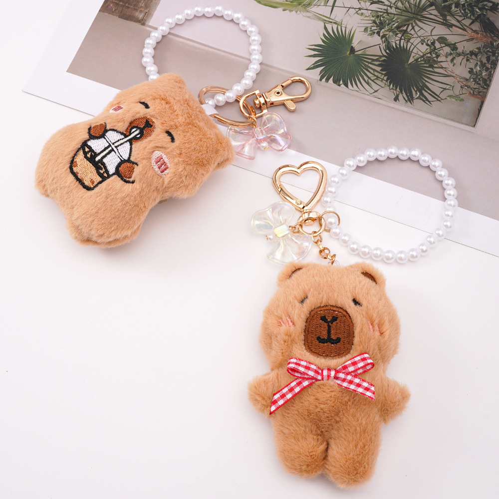 Colgante de bolso de animal de dibujos animados lindo Kapibala niña mochila llavero accesorios colgantes de perlas de felpa