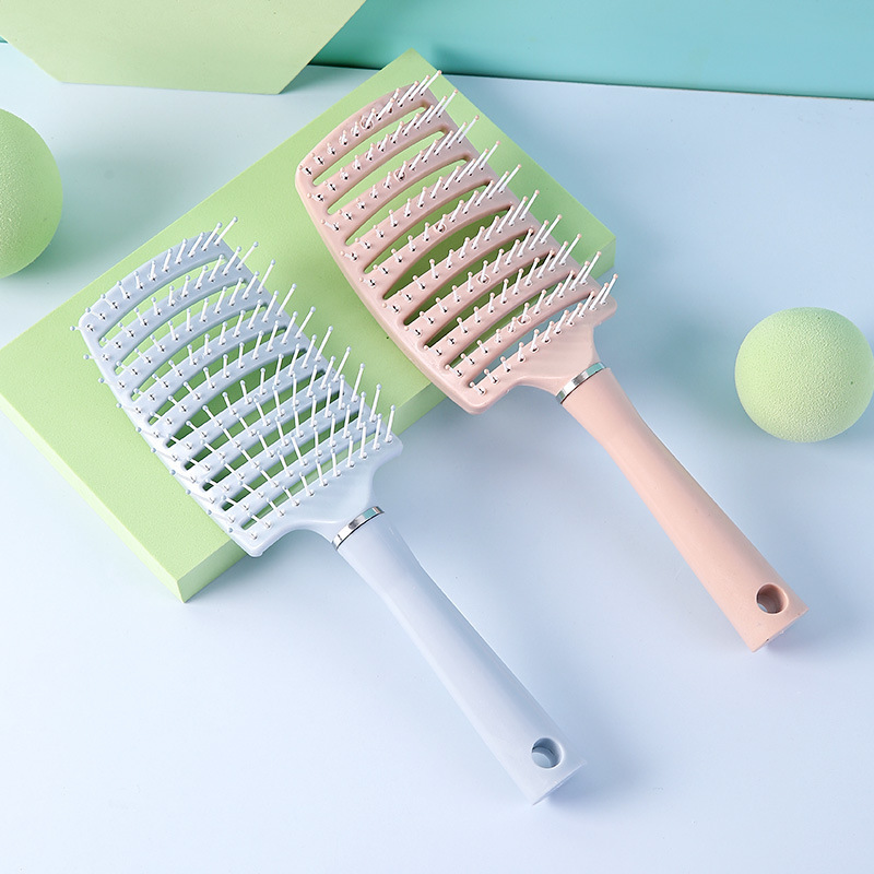 Peine curvo de gran volumen con dientes anchos y huecos para masaje, peinado y masaje del cuero cabelludo.