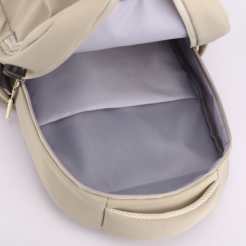 2023 verano nuevo estilo USB recargable mochila de nailon de gran capacidad para computadora de viaje de reducción de carga salvaje mochila escolar