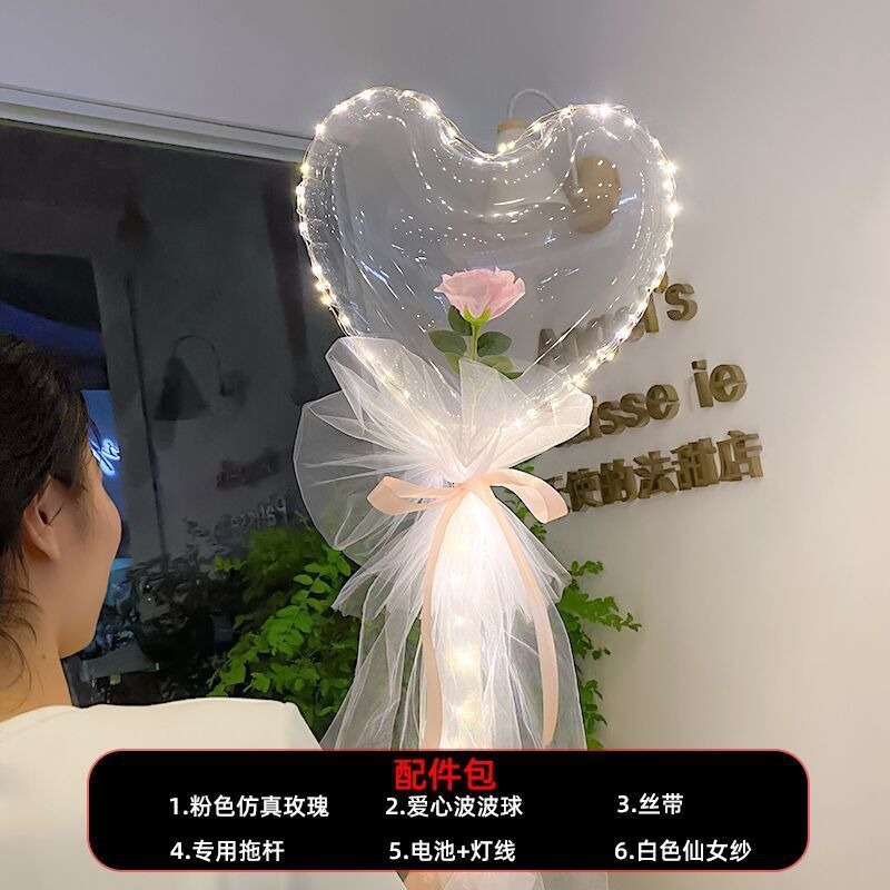 光る夜市の円形の赤い屋台のネットを並べてボールを押して会の風船のイルミネーションの明かりの告白のロマンチックな波の地帯のスーツを押します。|undefined
