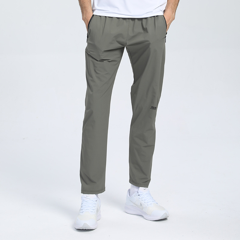 Pantalones deportivos de nylon transfronterizos para hombres en stock pantalones impresos de fitness elásticos hasta los tobillos pantalones de verano transpirables que absorben el sudor