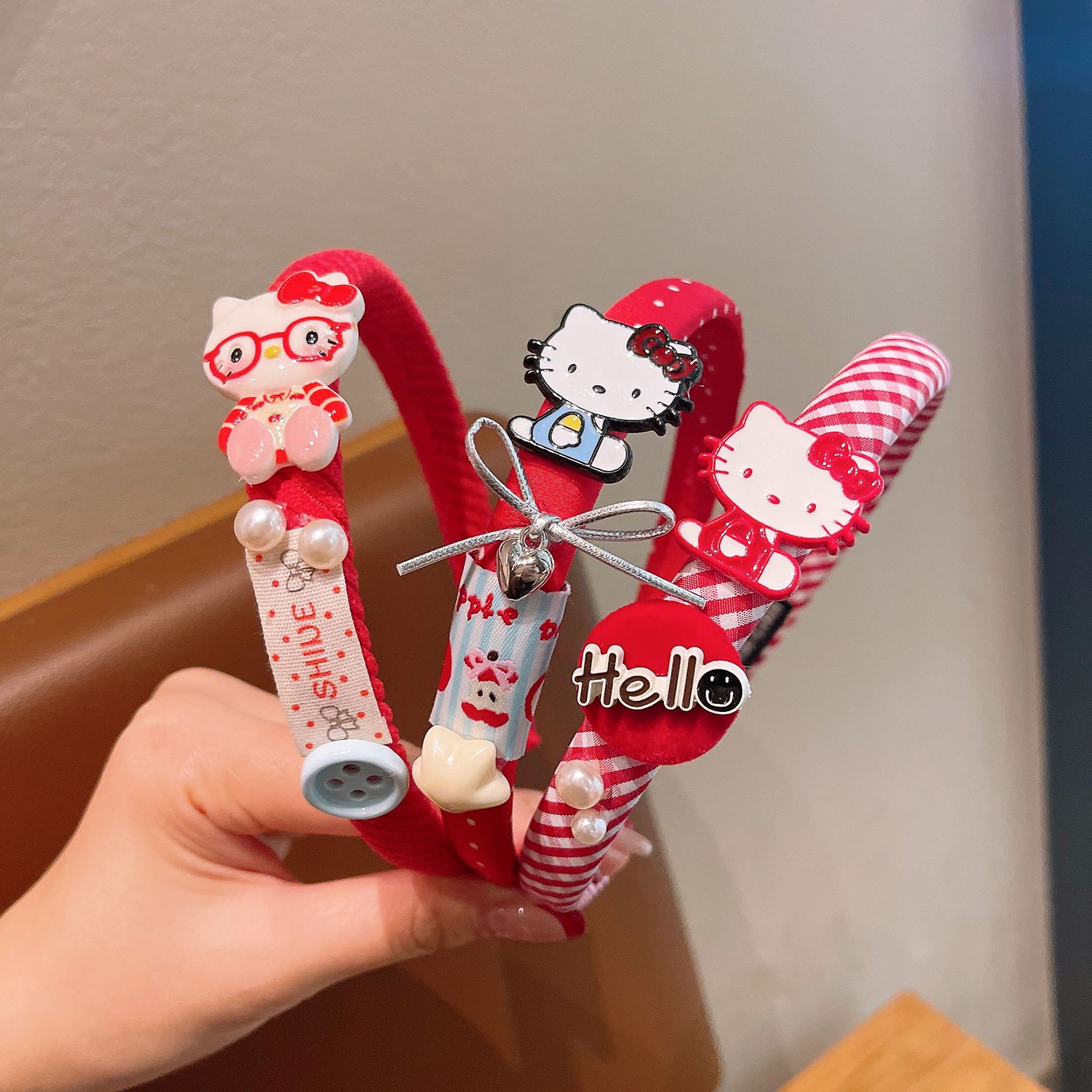 Nuevos niños al por mayor esponja banda de cabello de dibujos animados KT gato arco clip de cabello no estrangulación cabeza alta cráneo bebé joyería de cabello