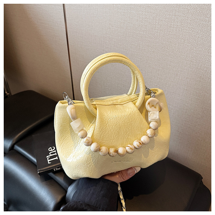 A stylish and trendy beaded bag for women, a new summer chain crossbody cloud bag for women in 2025 undefined