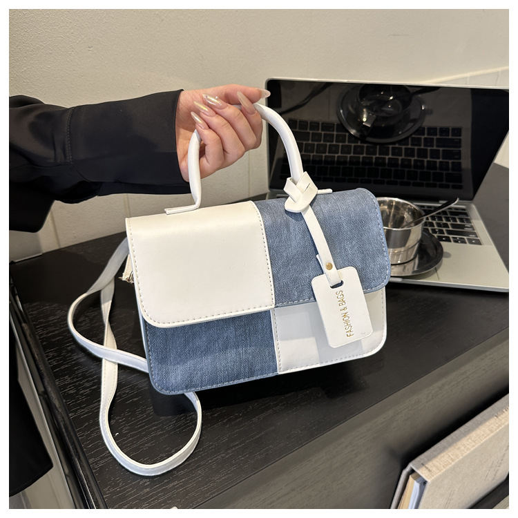 Nicho de diseño de color contrastante empalme bolso de mano 2025 nuevo mochila de textura bolso de hombro de moda