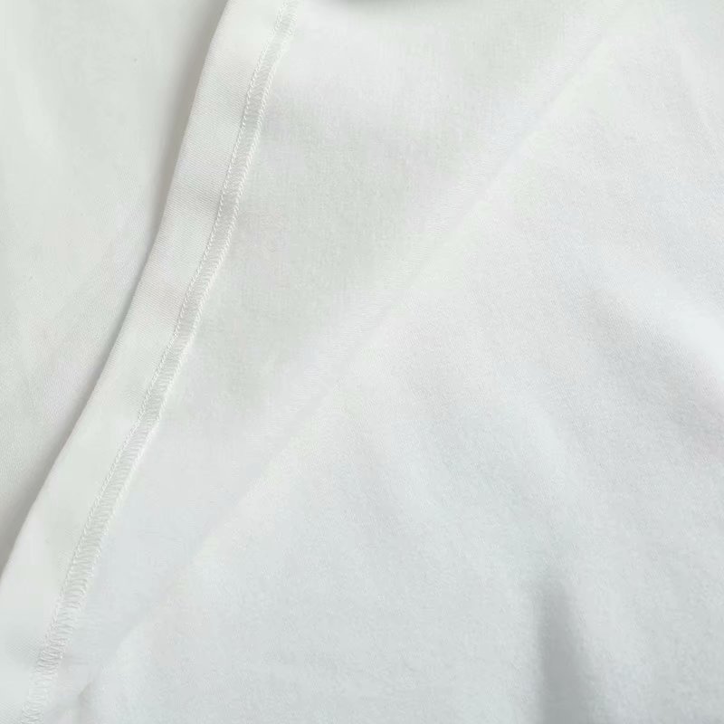 Top asimétrico blanco con cuello redondo y hombros acolchados NSAM40163