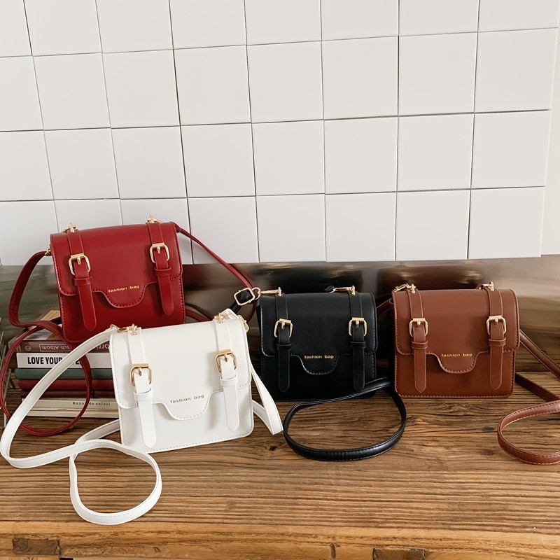 Nuevo cartero infantil Europa y América retro estilo británico universitario bolso de hombro para niños y niñas bolso de color sólido para niños