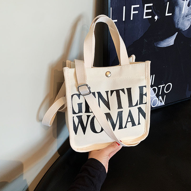 Moda rayas bolsa de lona para mujeres 2023 nueva carta impresión portátil bolsa de compras bolso de hombro al por mayor