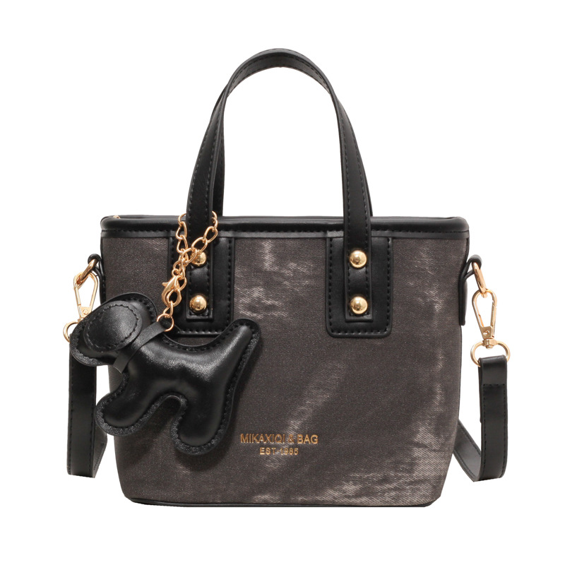 Mochila de alta textura de marea 2024 nuevo estilo versátil retro mochila de hombro de moda portátil bolso de cubo mujer