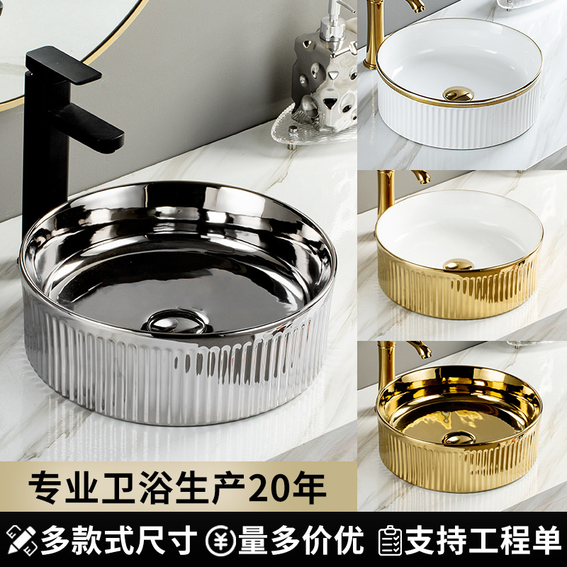 Baños de cerámica galvanizados nórdicos en la mesa de lavabo doméstico ligero de lujo lavabo único fábrica de venta directa