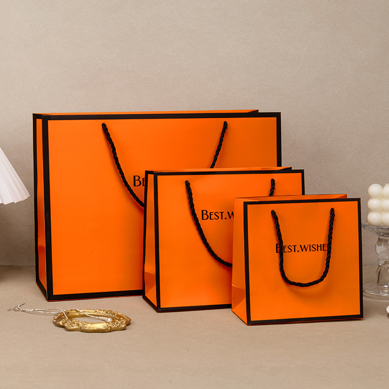 现货橙色大号礼品袋化妆品包装袋服装加厚白卡纸手提袋厂家批发