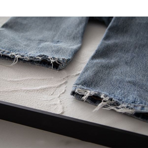 Pantalones vaqueros azules deshilachados de pierna recta americana retro con textura de copo de nieve pantalones casuales para hombres estilo no-501