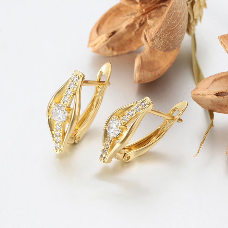 Xuping incrustado una sola fila de gemas artificiales europeas y estadounidenses transfronterizas moda fría viento personalidad auriculares al por mayor mujeres