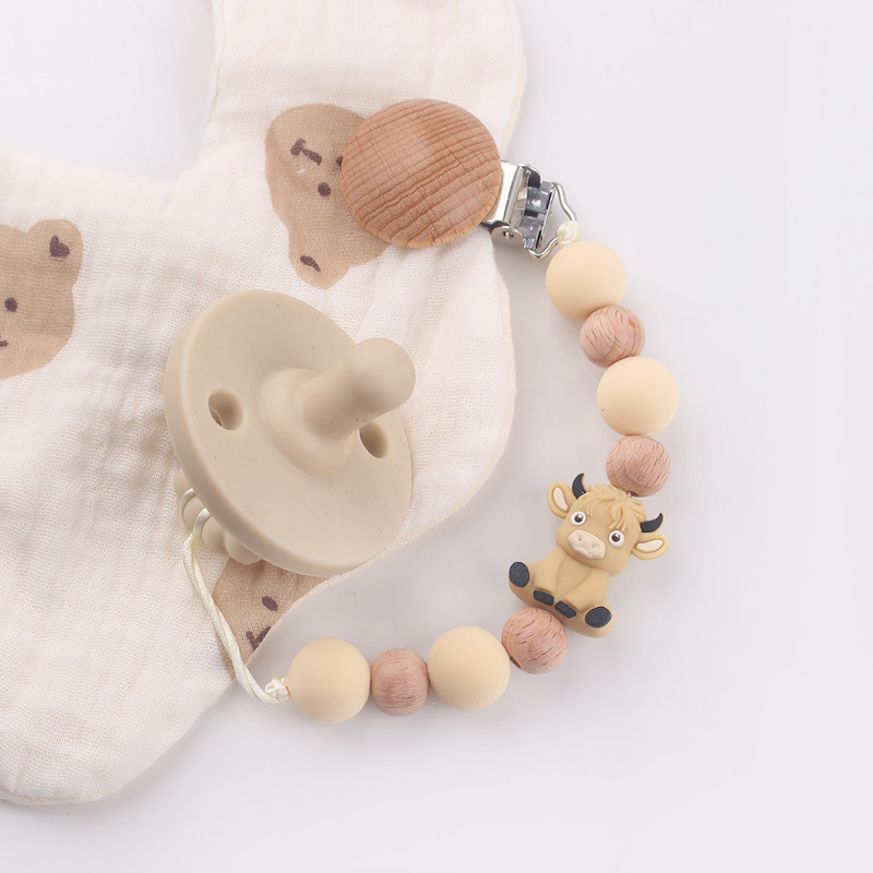 Productos para bebés y niños abrazadera de chupeta de beech creativa caricatura estereoscópica buey mordida cadena de chupeta de dientes molares anti-caída cadena