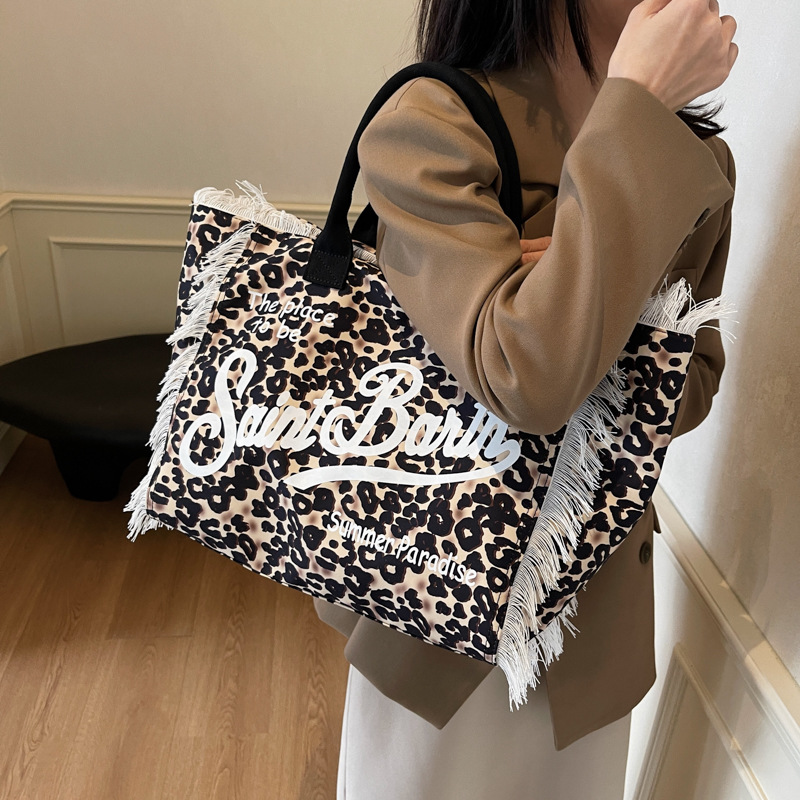 Bolso de moda coreano de moda de verano 2025, nuevo bolso de mano de leopardo personalizado, bolso de hombro retro de gran capacidad.