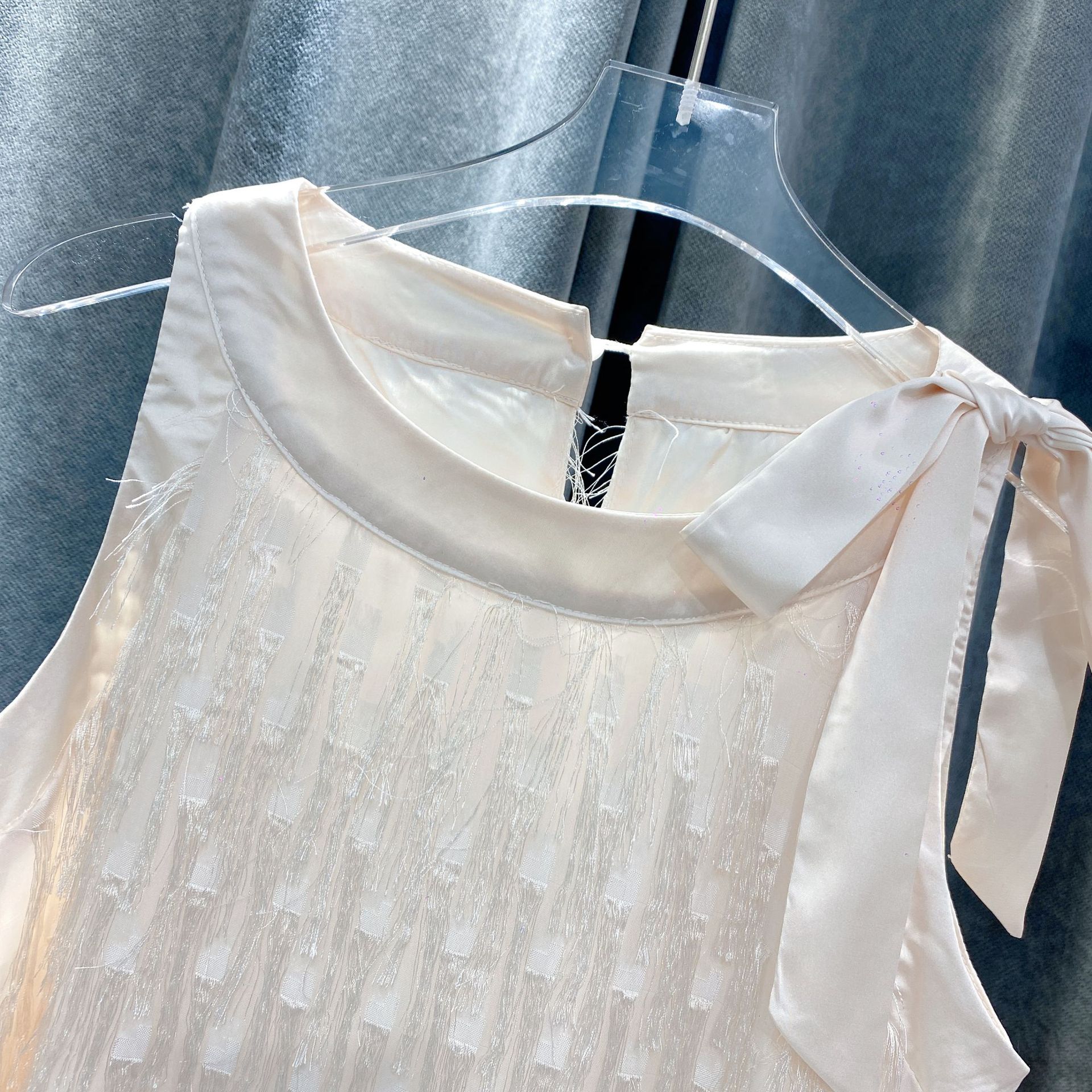 Matching white dresses with fringe details for mommy and me