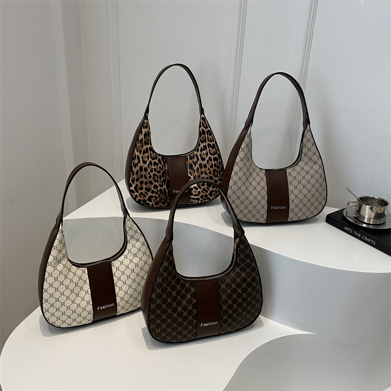 Arte y literatura color contrastante empalme viaje bolso de media luna portátil retro 2025 personalidad nueva moda braza de hombro bolso de mujer