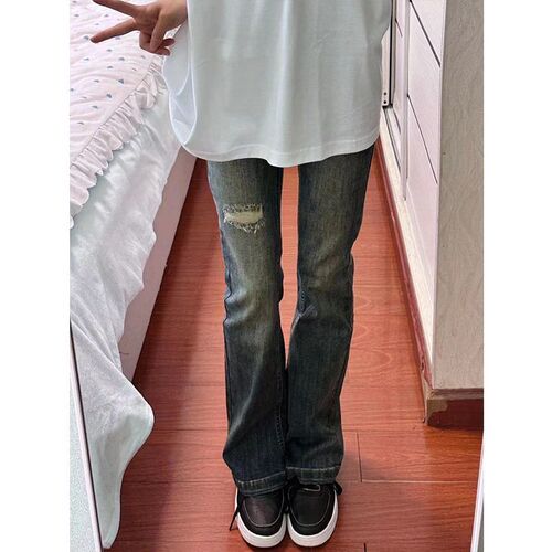 American-style vintage washed distressed ripped bootcut jeans for women, high-waisted, slim-fit, figure-flattering, floor-length trendy pants.