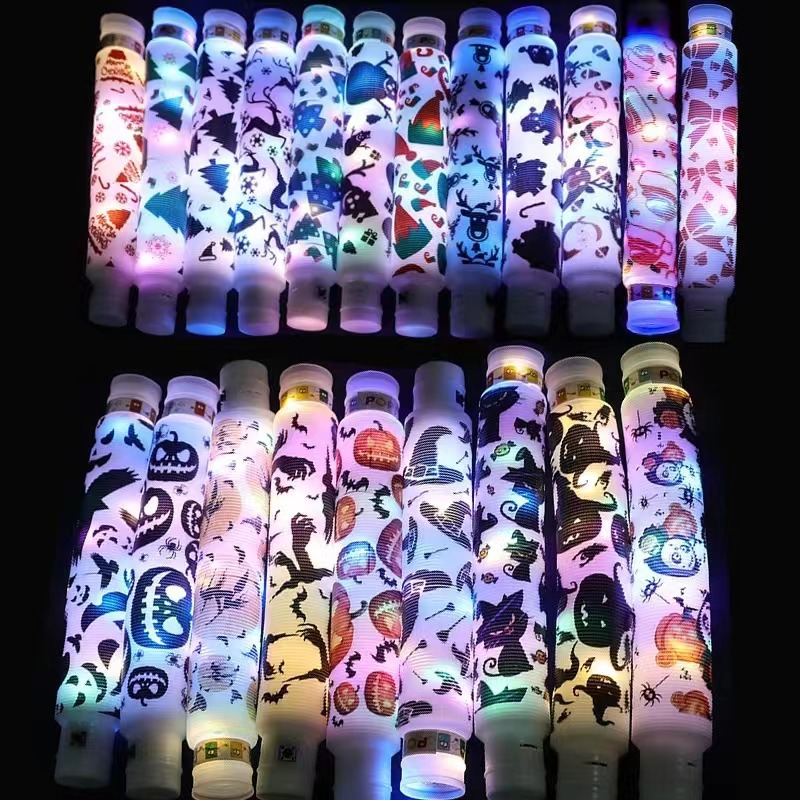 Flash transfronterizo fuelle de ventilación descompresión de luz LED tubo de agua pop tubo de descompresión luminosa tubo telescópico al por mayor