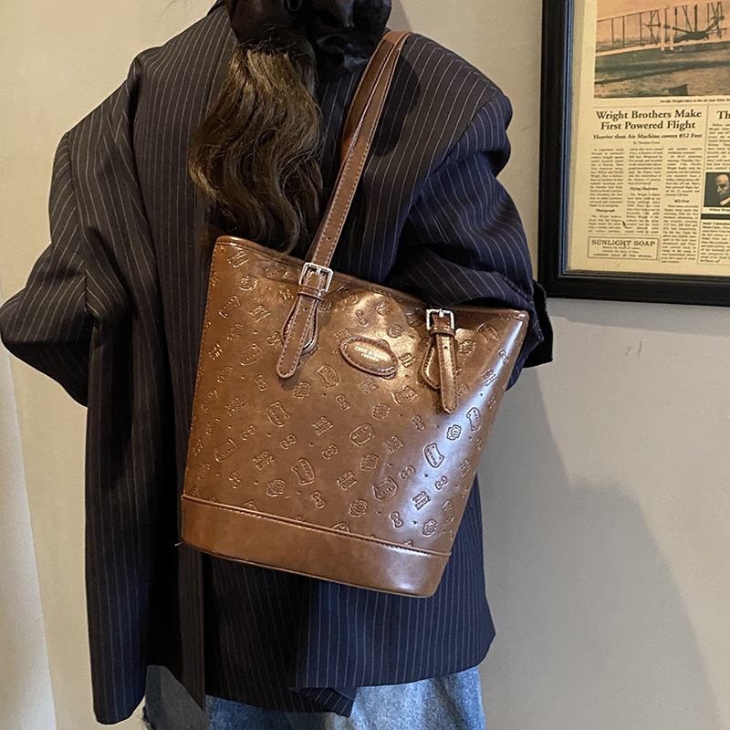 Cross-border 2025 otoño y invierno nuevo retro leopardo bolso de brazo de moda de viaje bolso de cubo de mujer moda coreana bolso de hombro