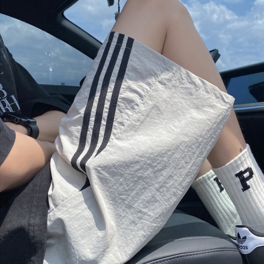 Pantalones cortos de secado rápido de tres barras estadounidenses pantalones finos de cinco puntos rectos transpirables de verano para hombres pantalones de chándal de playa casuales sueltos