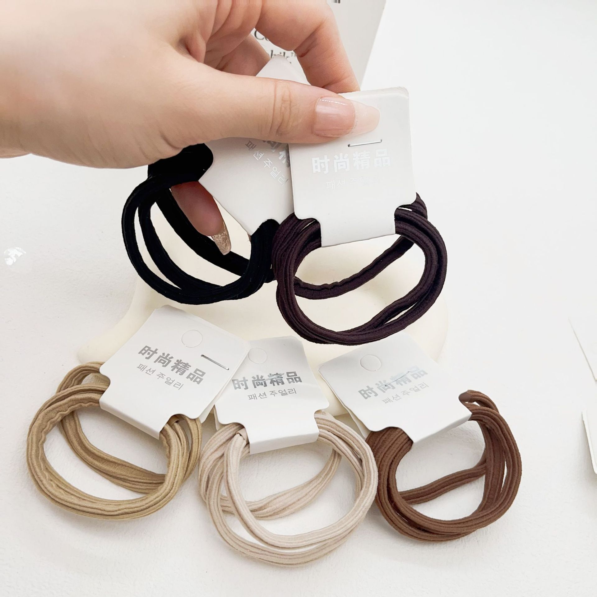 Dongdaemun estilo coreano hilo colorido accesorios para el cabello cuerda de pelo asequible banda de pelo de alta elasticidad de tres paquetes de banda de goma de dos yuanes tienda al por mayor image 18