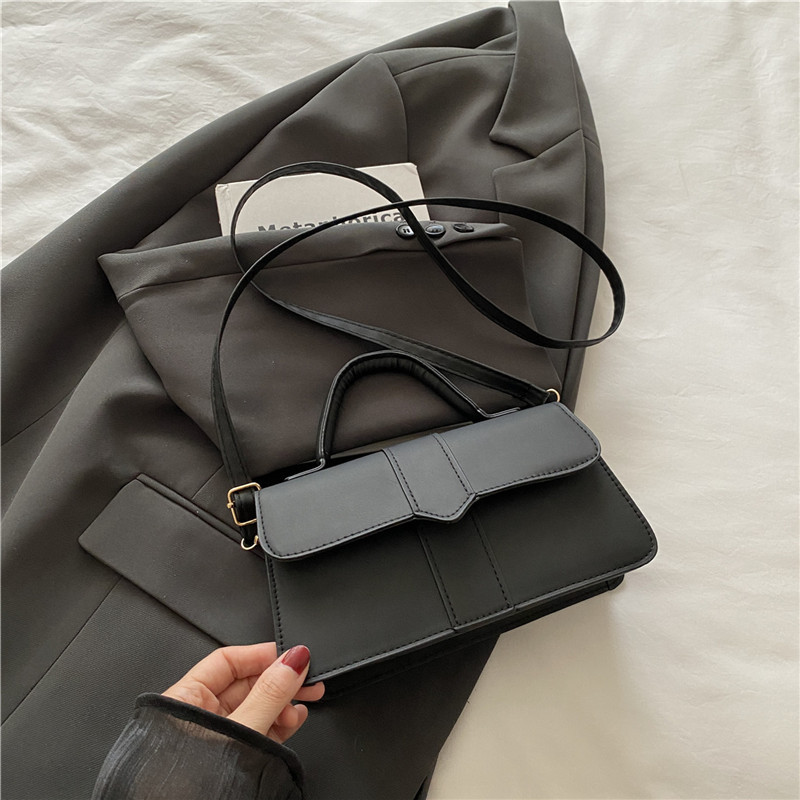 Bolso de color sólido de diseño de nicho para mujer 2025 nuevo bolso cuadrado portátil de moda de moda bolso de mensajero de alta gama de todo fósforo