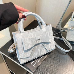 ファッションの蝶結びの片肩のハンドバッグの女性の潮2025新型のファッションの斜めのショルダーバッグのシンプルな女性のカバンの小さい方のカバンの女性