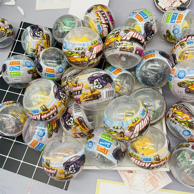 75mm扭蛋高档混装扭蛋球汽车积木公仔覆膜透明款益智扭扭蛋球批发
