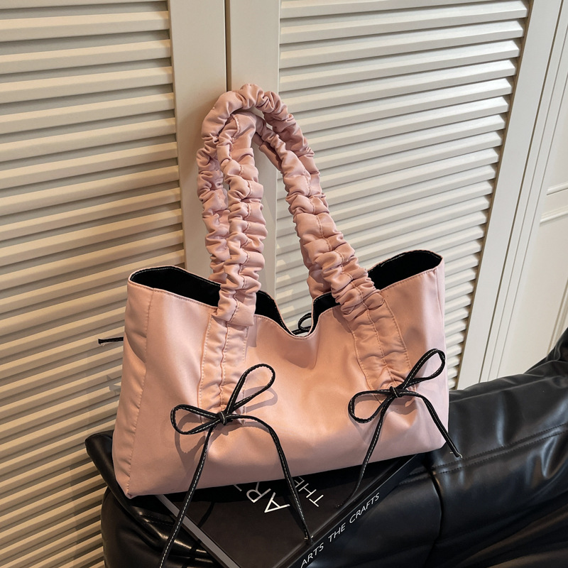 Bolso de arco de la mujer 2025 nueva moda coreana bolso de tela de gran capacidad bolso de mujer de alto valor facial