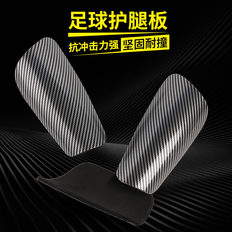 Football shin guards, sports protective gear, black carbon pattern sports football socks, protective pads, impact-resistant professional foot guards factory