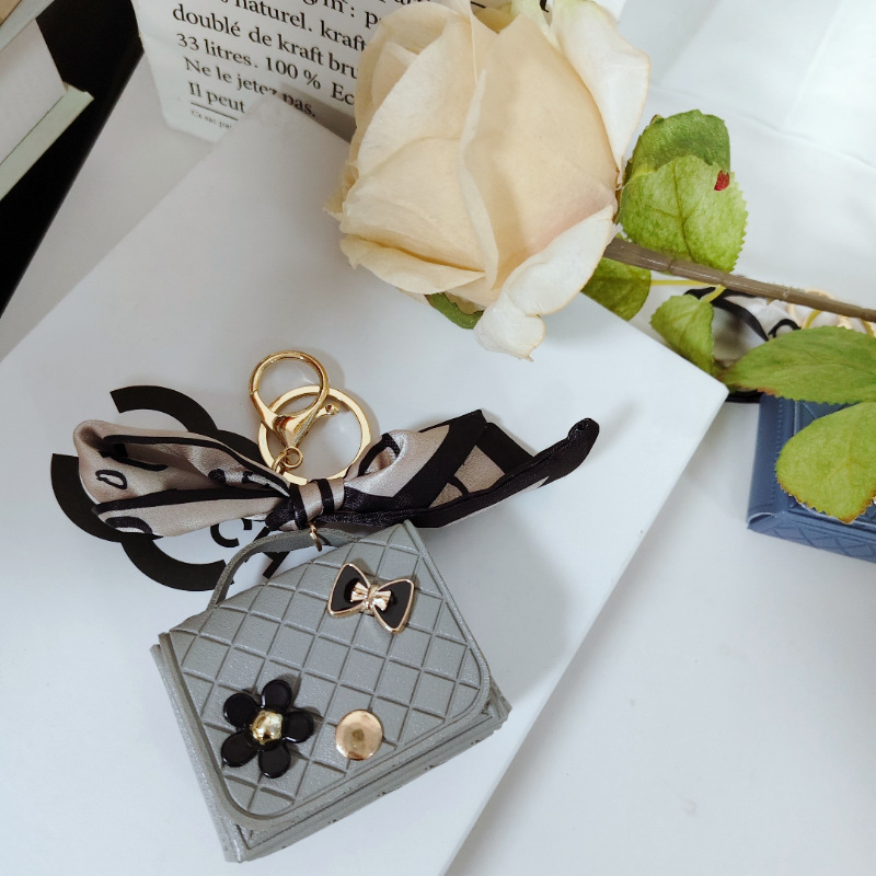 Nuevo estilo transfronterizo, moderno y exclusivo mini bolso acolchado tipo colgante, monedero para llaves, accesorio para auriculares.