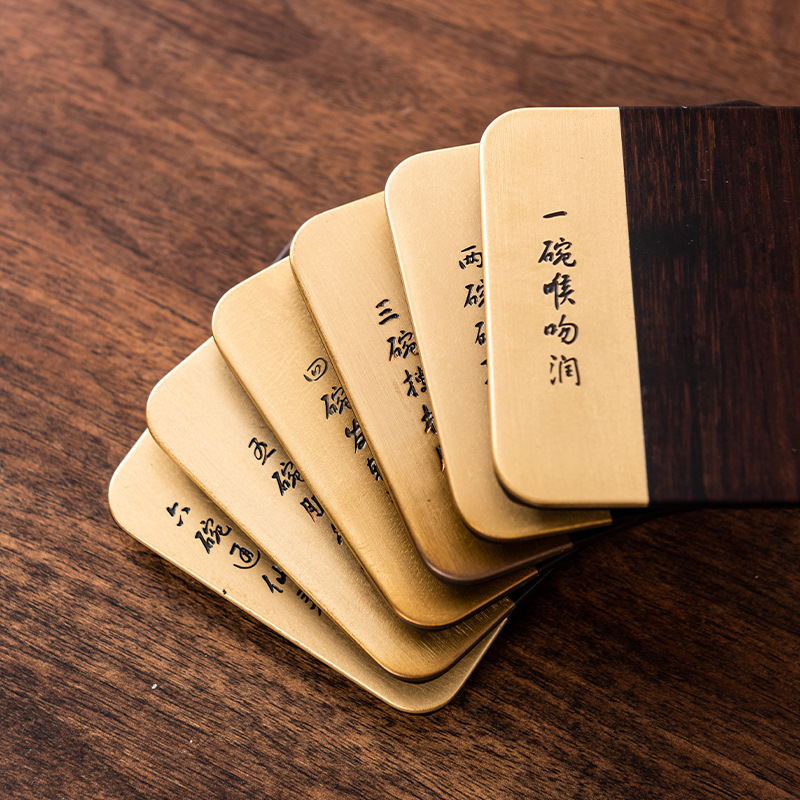 Ébano montaña ligera de lujo de cobre de madera combinado almohadilla de aislamiento de kung fu juego de té titular de la taza de té del hogar accesorios del juego de té al por mayor Negro